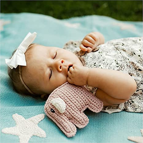 baby and child playing with handmade cotton yarn elephant rattle Pebble Brand