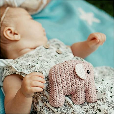 baby and child playing with handmade cotton yarn elephant rattle Pebble Brand